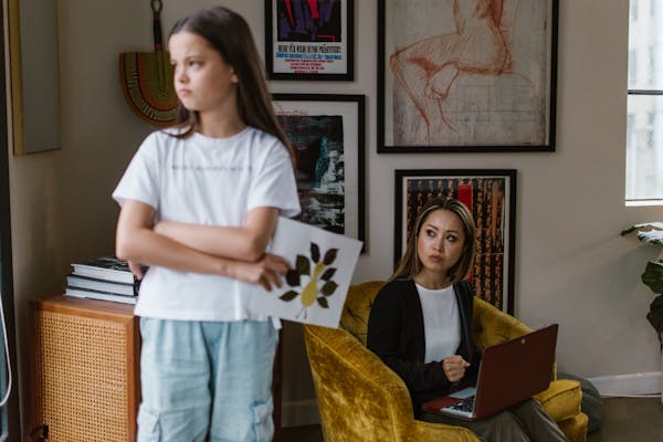 A mother and daughter share an emotional moment at home, highlighting family dynamics.