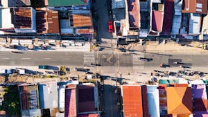 Aerial shot of an urban street intersection in Bacong, Central Visayas, Philippines on a sunny day.